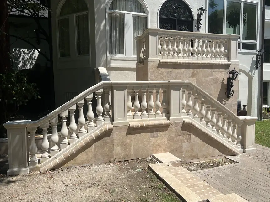 Cast stone balustrade staircase and balcony on a stucco house